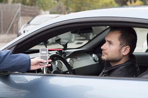 Person taking breathalyzer test